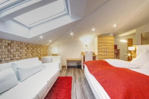 Postel nebo postele na pokoji v ubytování Hotel Jakob