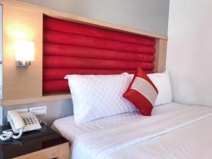 Postel nebo postele na pokoji v ubytování 墾丁合歡8宿-Ho Huan B & B