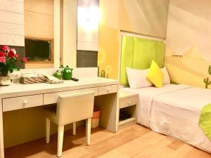 Postel nebo postele na pokoji v ubytování 墾丁合歡8宿-Ho Huan B & B