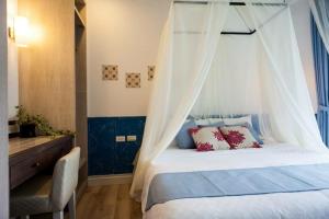 Postel nebo postele na pokoji v ubytování 墾丁合歡8宿-Ho Huan B & B