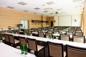 a room with rows of tables and chairs at Hotel Euro in Pardubice
