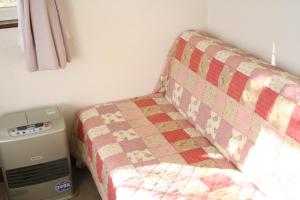 Llit o llits en una habitació de Pension Asahi