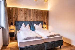 Posteľ alebo postele v izbe v ubytovaní Chalet's DAS DORF