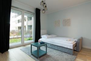 Łóżko lub łóżka w pokoju w obiekcie ShortStayPoland Żupnicza (B32)