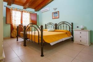 Katil atau katil-katil dalam bilik di La Capinera