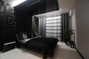 Posteľ alebo postele v izbe v ubytovaní Apartament Lema Versace