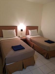 Postel nebo postele na pokoji v ubytování Hotel Sri Sutra PJ 222