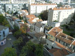 an aerial view of a city with buildings at La Maison Rouge in Paris