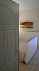 a door leading to a bedroom with a bed at Monolocale di Via Mameli in Verona