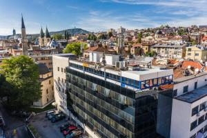 an aerial view of a city with a building at Hotel Art in Sarajevo