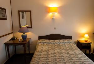 Postel nebo postele na pokoji v ubytování Hôtel de Flandre
