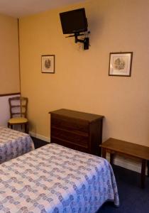 Postel nebo postele na pokoji v ubytování Hôtel de Flandre