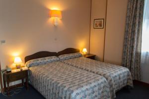 Postel nebo postele na pokoji v ubytování Hôtel de Flandre