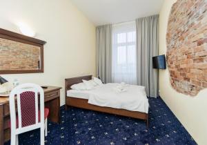 Postel nebo postele na pokoji v ubytování Hotel Marczewski