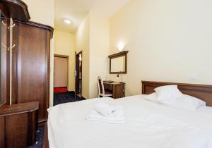 Postel nebo postele na pokoji v ubytování Hotel Marczewski