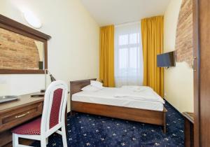 Postel nebo postele na pokoji v ubytování Hotel Marczewski