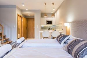 Posteľ alebo postele v izbe v ubytovaní Royal Hill Residence