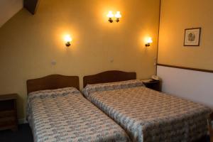 Postel nebo postele na pokoji v ubytování Hôtel de Flandre
