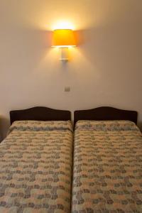 Postel nebo postele na pokoji v ubytování Hôtel de Flandre