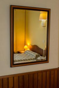 Postel nebo postele na pokoji v ubytování Hôtel de Flandre