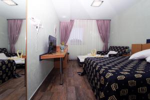 Postel nebo postele na pokoji v ubytování Iris Hotel