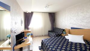 Postel nebo postele na pokoji v ubytování Iris Hotel