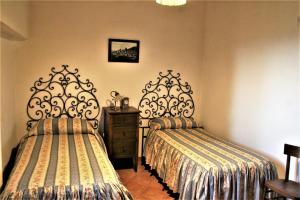 Giường trong phòng chung tại Antica Torre "La Casalta"