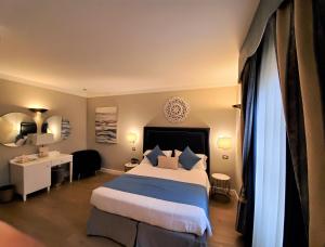 Postel nebo postele na pokoji v ubytování Hotel Goya