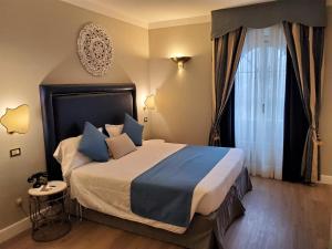 Postel nebo postele na pokoji v ubytování Hotel Goya