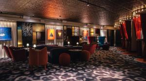 a lobby with couches and tables and chairs at Hotel Rival in Stockholm