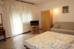 Postel nebo postele na pokoji v ubytování Apartment Valentina
