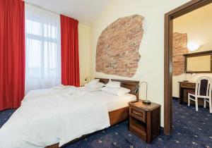 Postel nebo postele na pokoji v ubytování Hotel Marczewski