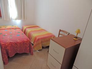 Postel nebo postele na pokoji v ubytování Residence della Torre Isola Rossa
