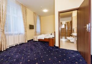 Postel nebo postele na pokoji v ubytování Hotel Marczewski