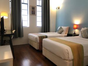 Postel nebo postele na pokoji v ubytování Spices Hotel