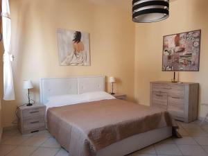 Ένα ή περισσότερα κρεβάτια σε δωμάτιο στο Appartamenti Via La Marmora