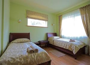 Postel nebo postele na pokoji v ubytování El Arm El