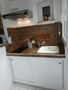 a kitchen with a sink and a counter top at STUDIO TOUT A PIEDS in Sanary-sur-Mer