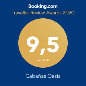 a yellow circle with the number nine and the text travelling review awards at Cabañas Oasis de San Pablo in San Pablo +104 photos