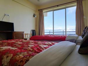 Llit o llits en una habitació de Hotel Green Valley Nagarkot