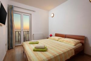 Кровать или кровати в номере Apartments Antonio - Podstrana, Split