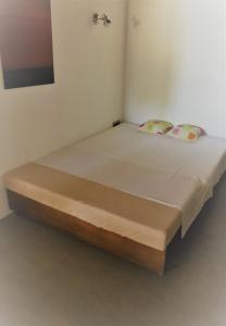 Ein Bett oder Betten in einem Zimmer der Unterkunft Casa S'Olibassa