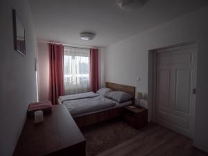 Katil atau katil-katil dalam bilik di Apartmán Lopi