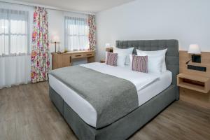 Postel nebo postele na pokoji v ubytování Hotel Obermaier