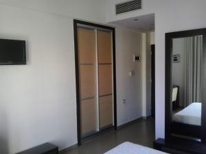 Postel nebo postele na pokoji v ubytování Hotel Kipseli