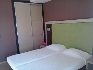 Postel nebo postele na pokoji v ubytování Hotel Kipseli