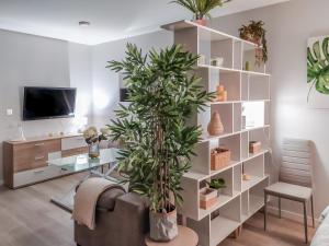 Televízia a/alebo spoločenská miestnosť v ubytovaní Big Apple Apartment Granada by A3Rentals
