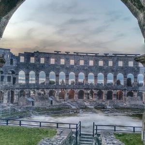 a view of the colosseum from inside the building at Apartmani Val in Pula