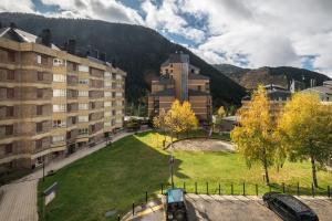 a city with a building and a grassy field at Argulls by Totiaran in Naut Aran
