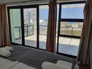 Ένα ή περισσότερα κρεβάτια σε δωμάτιο στο Adam's Guest House